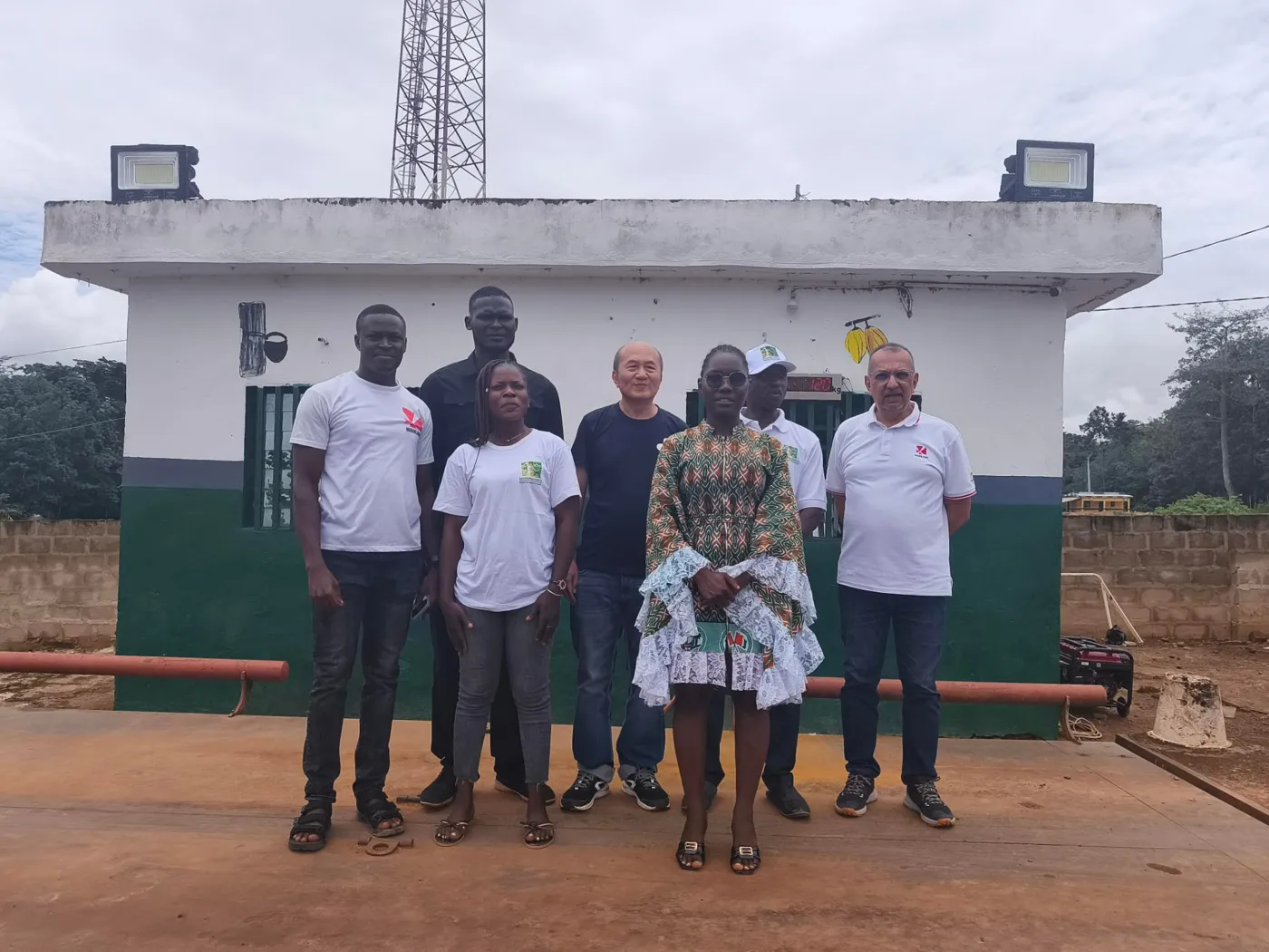 Field team and partners outside a buying station weighbridge